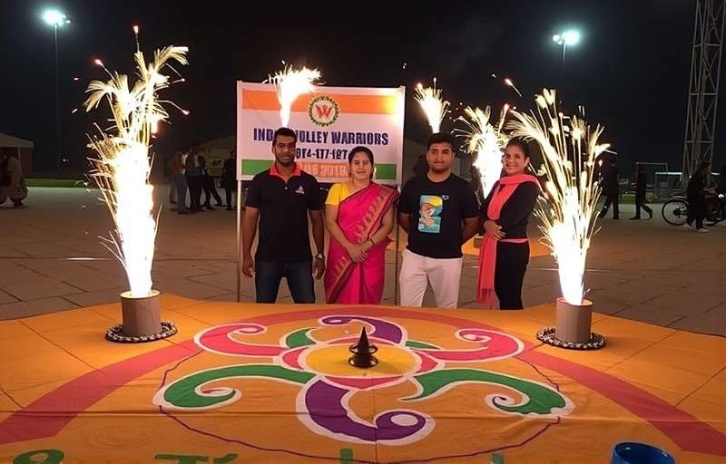 India Volley Warriors - Diwali Special Event India Volley Warriors Diwali special event with players celebrating with fireworks and traditional rangoli designs